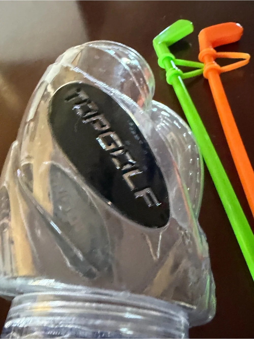 Topgolf plastic drink cup with Green and Orange Drink golf club straws